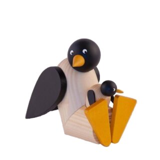 Pinguin mit Baby sitzend